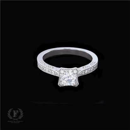 ROUND DIAMOND ENGAGEMENT RING WITH FLEURS DE LIS