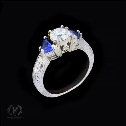 DIAMOND & SAPPHIRE THREE-STONE ENGAGEMENT RING