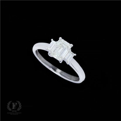 THREE STONE EMERALD CUT DIAMOND ENGAGEMENT RING