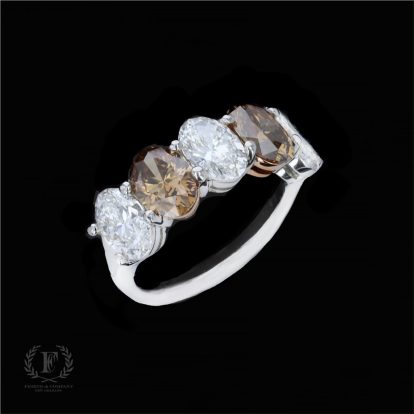 WHITE & FANCY BROWN OVAL CUT DIAMOND RING